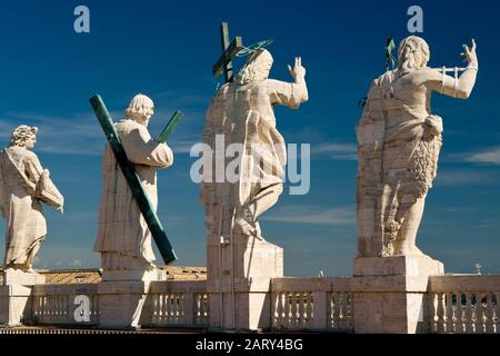 Statues of Christ and the apostles on the roof of St. Peter`s basilica, Vatican Stock Photo